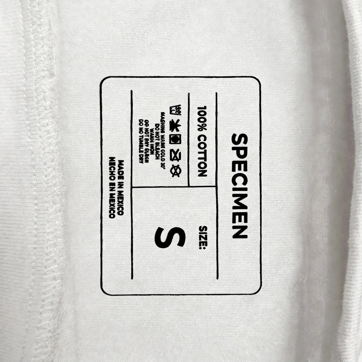 Doers Club white printed neck label