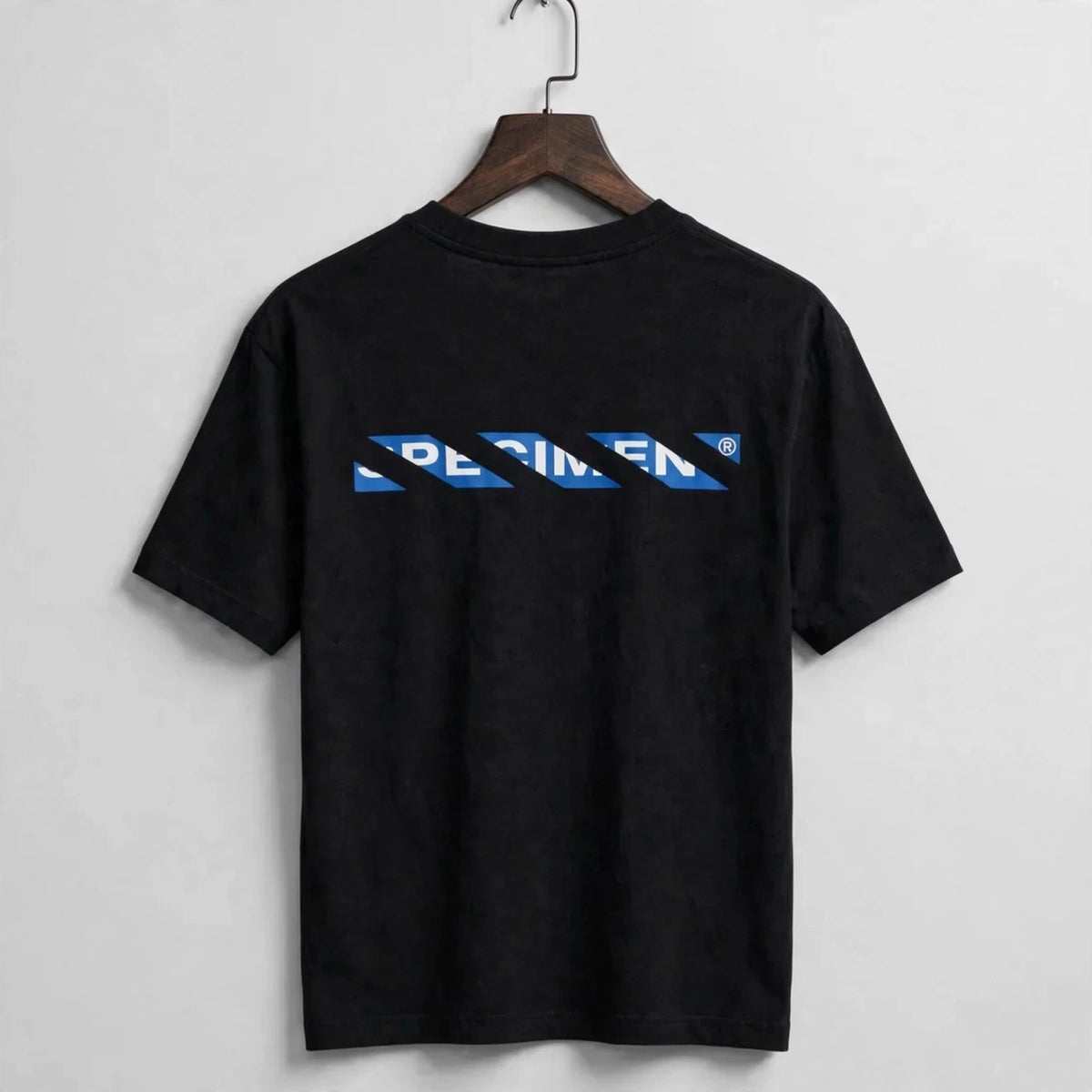 Half Show Diagonal Tee back graphic on hanger